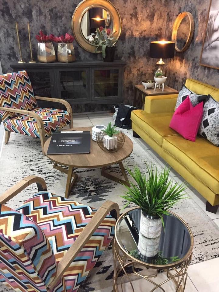 A zigzag armchair and round coffee table